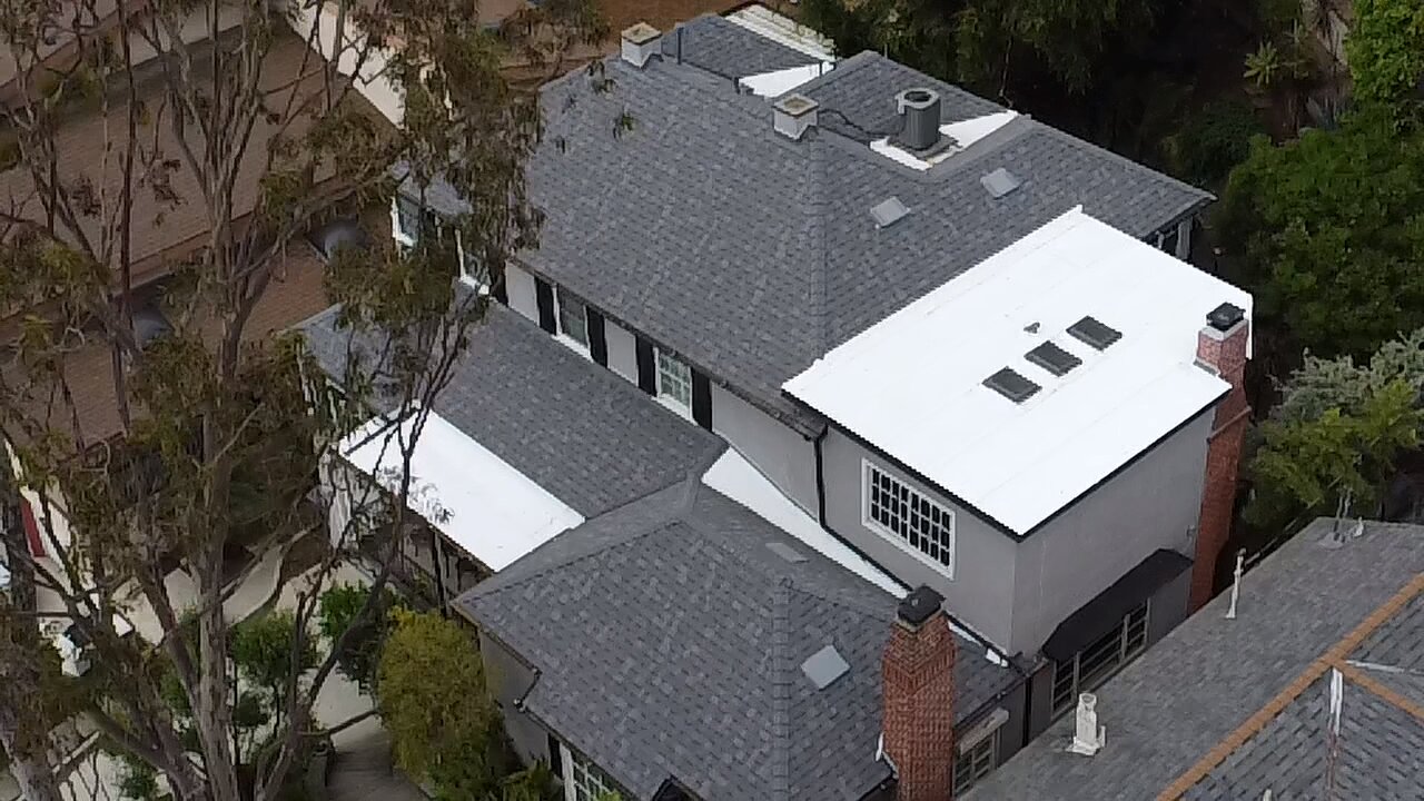 Two-tone shingle and flat roof