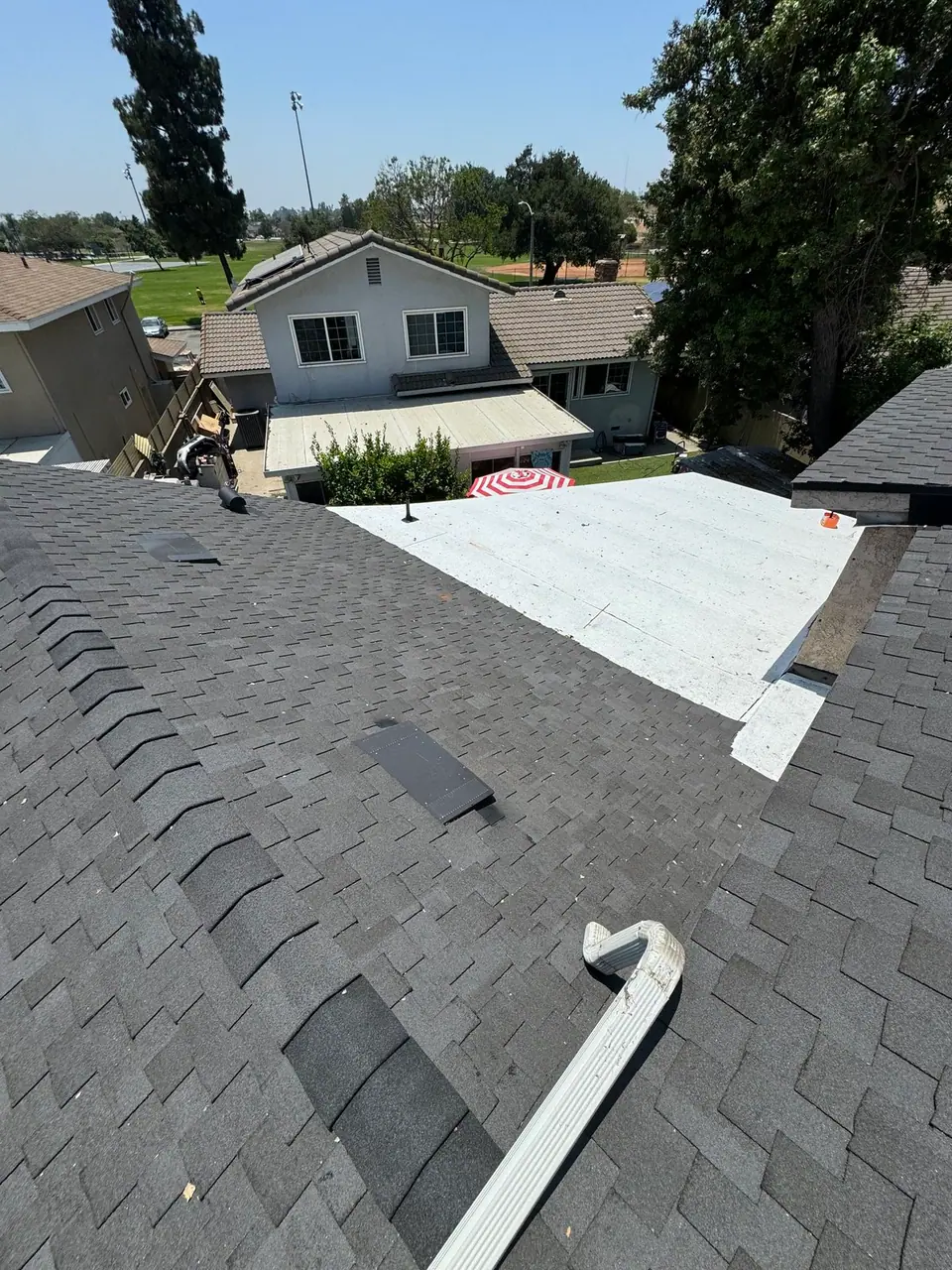 Finished shingle roof with new flashing